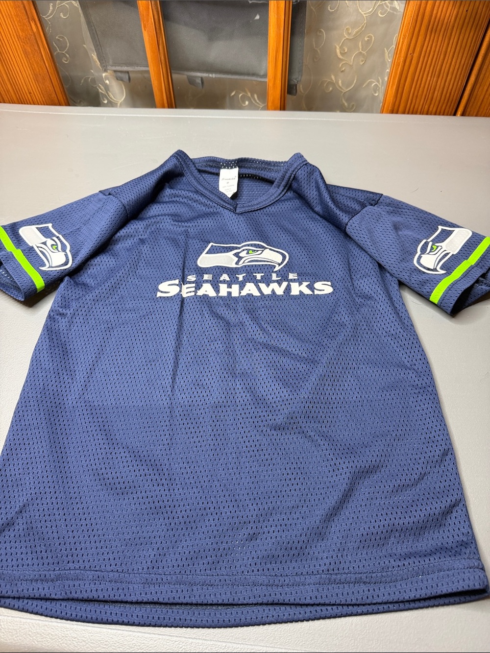 Kid’s Seattle Seahawk Navy Short-Sleeve mesh Jersey. Size: medium. NWOT